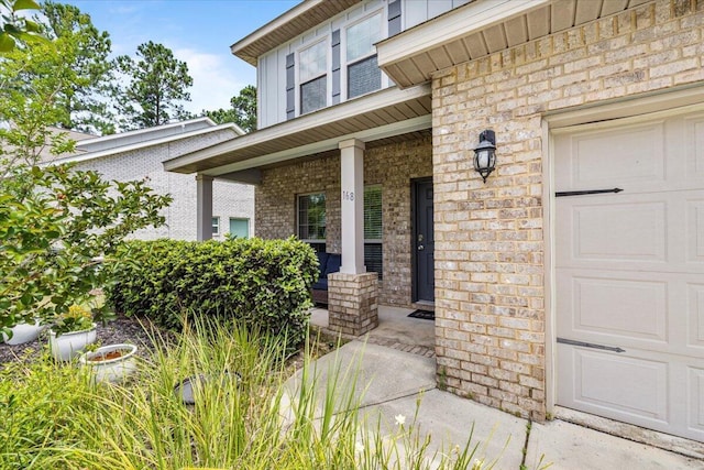 entrance to property with covered porch