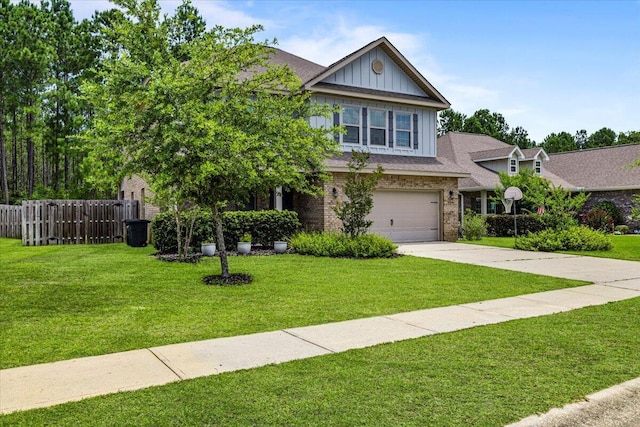 view of front of home featuring a garage and a front yard