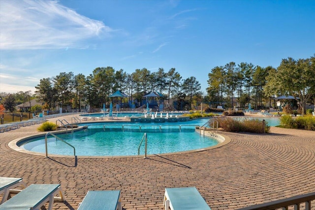 view of pool featuring a patio area