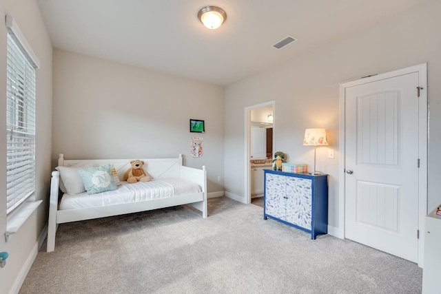 sitting room featuring light carpet