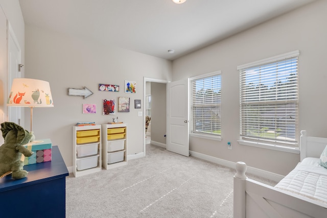 bedroom with light colored carpet