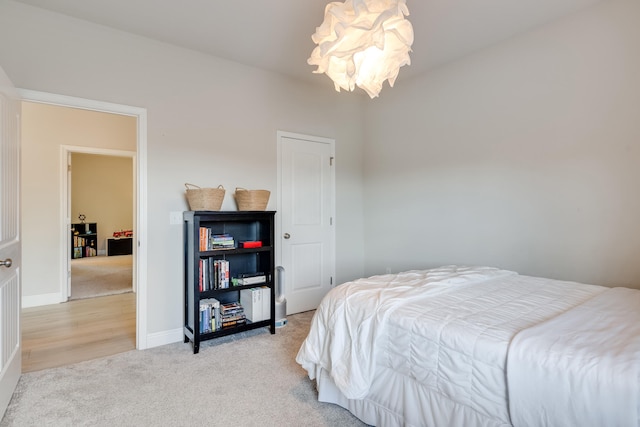 168 Secret St, Freeport, FL 32439 - carpeted bedroom featuring a chandelier and baseboards
