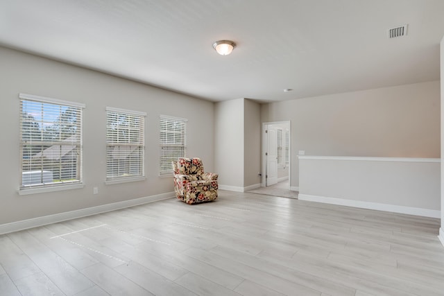 unfurnished room featuring light hardwood / wood-style flooring