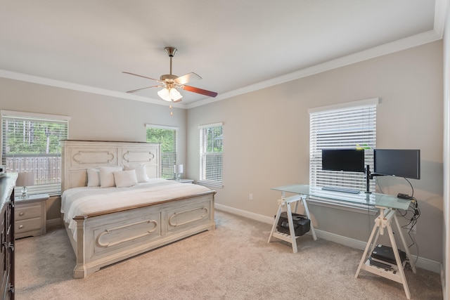 168 Secret St, Freeport, FL 32439 - bedroom with ornamental molding, multiple windows, baseboards, light colored carpet, and a desk
