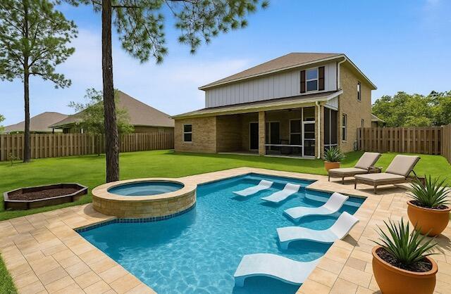 168 Secret St, Freeport, FL 32439 - rear view of property featuring a sunroom, a patio, and a pool with connected hot tub