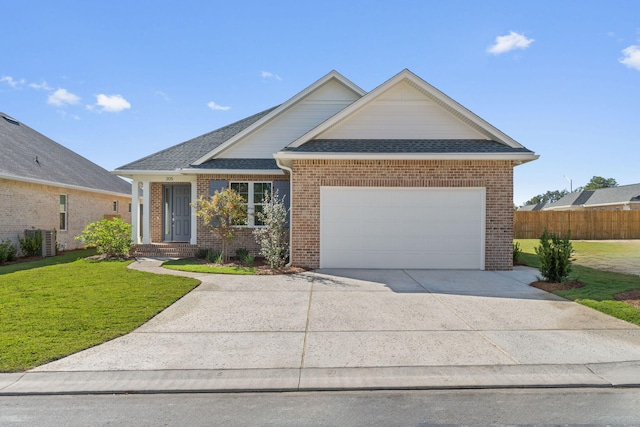 view of front of property with cooling unit, a front yard, and a garage