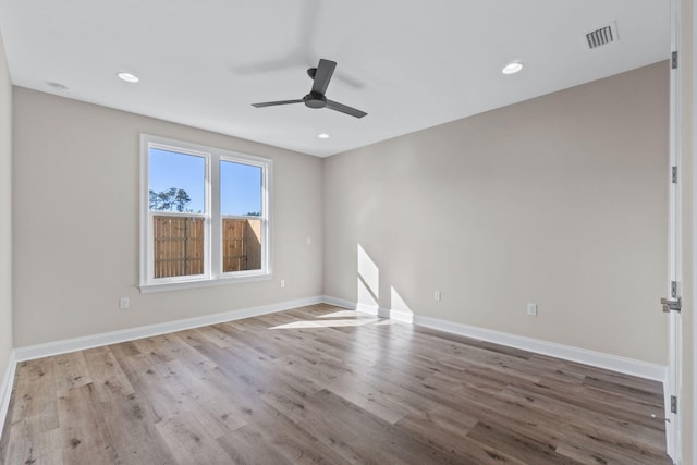 unfurnished room with ceiling fan and light hardwood / wood-style flooring