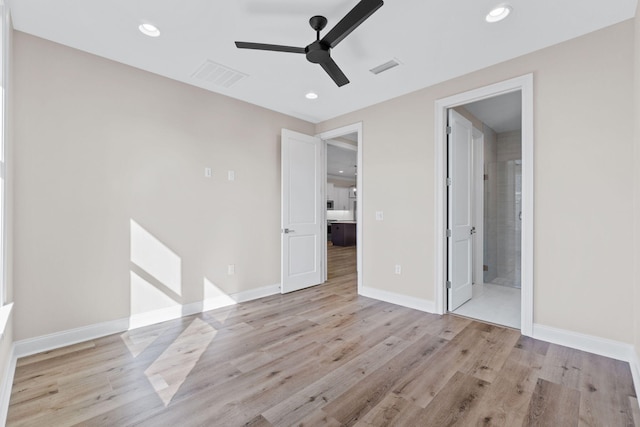 unfurnished bedroom featuring connected bathroom, ceiling fan, and light hardwood / wood-style floors