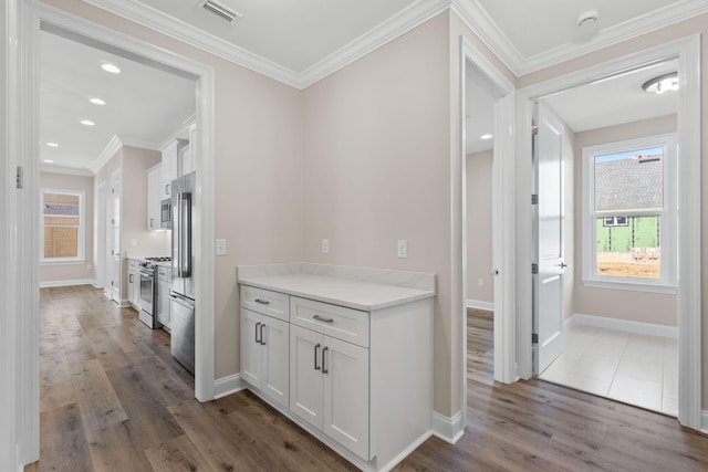 hallway featuring crown molding and dark hardwood / wood-style flooring