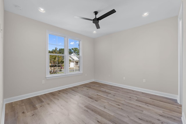 spare room featuring ceiling fan and light wood-type flooring