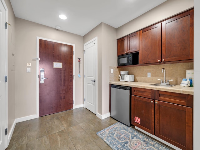 kitchen with tasteful backsplash, sink, and stainless steel dishwasher