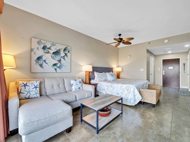 bedroom with tile patterned flooring and ceiling fan