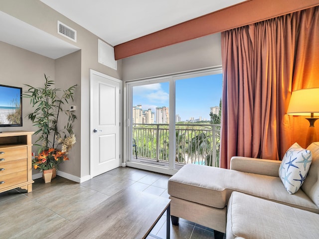 living area with tile patterned flooring