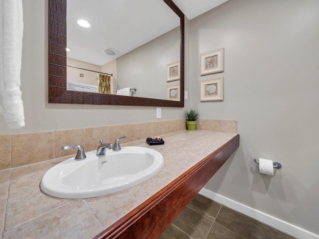 bathroom featuring tile patterned flooring and sink