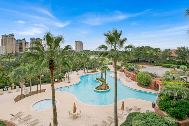 view of swimming pool with a patio area