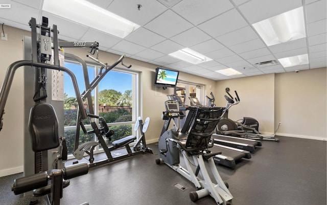 exercise room with a drop ceiling