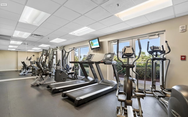 gym featuring a paneled ceiling