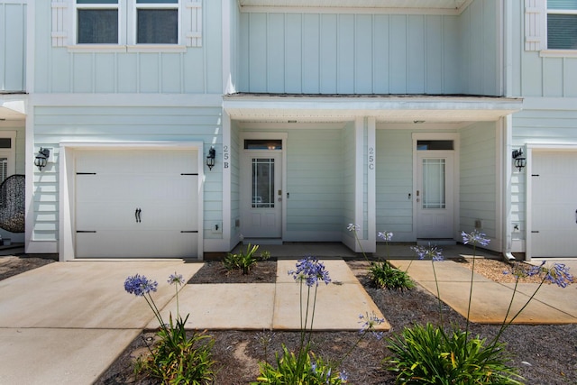 doorway to property with a garage