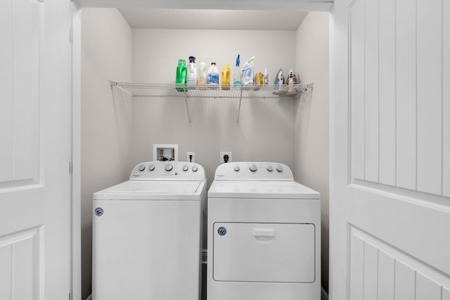 laundry room featuring electric dryer hookup, washer hookup, and washing machine and dryer