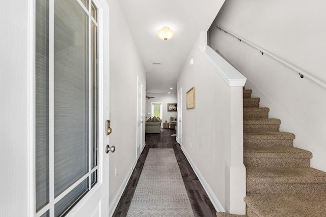 corridor featuring dark wood-type flooring