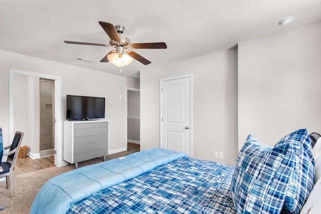 bedroom featuring ceiling fan and hardwood / wood-style flooring