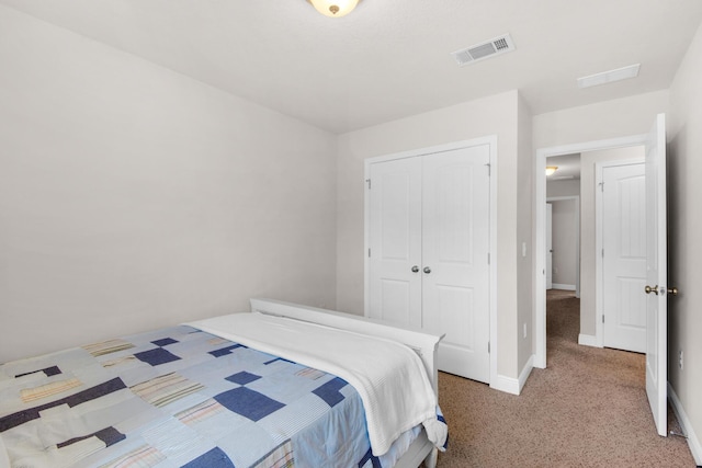 carpeted bedroom featuring a closet