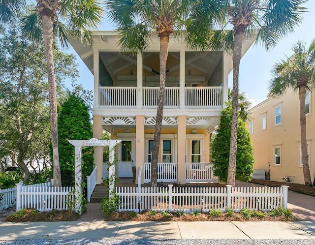 view of front facade featuring covered porch and a balcony