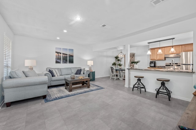 living room featuring sink