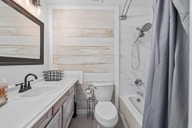 full bathroom featuring vanity, toilet, and shower / tub combo with curtain