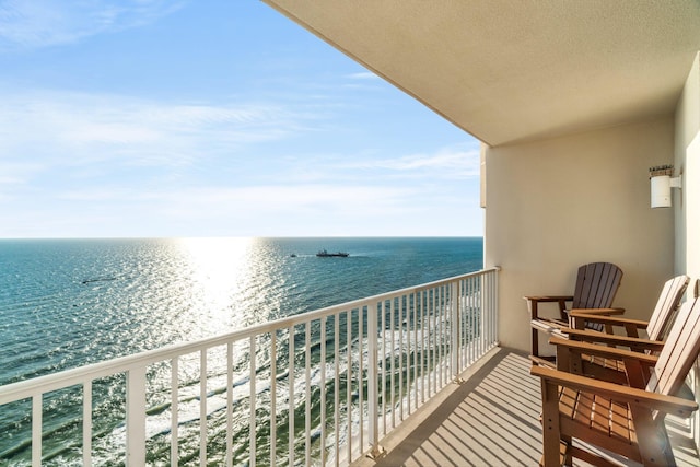 balcony featuring a water view