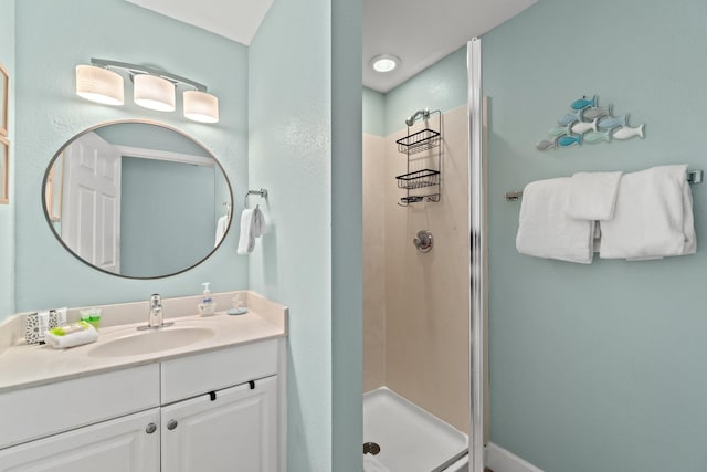 bathroom featuring walk in shower and oversized vanity