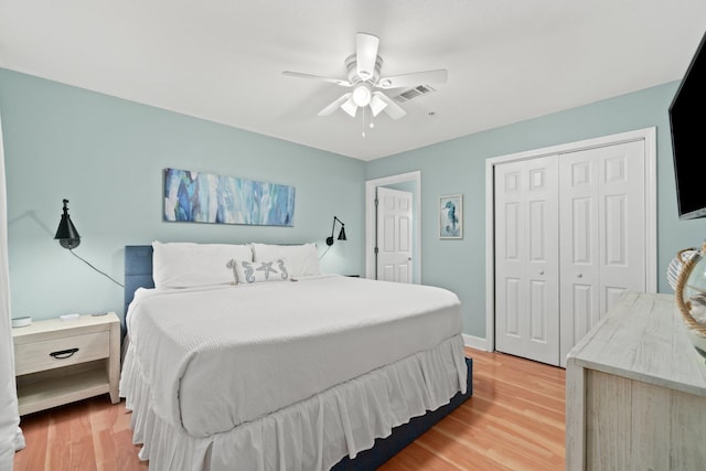 bedroom featuring light hardwood / wood-style floors, a closet, and ceiling fan