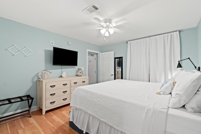 bedroom with light wood-type flooring and ceiling fan