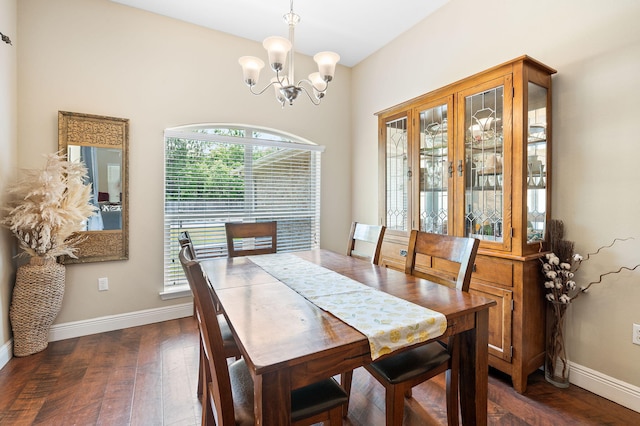 dining area featuring a notable chandelier, a healthy amount of sunlight, and dark wood-type flooring