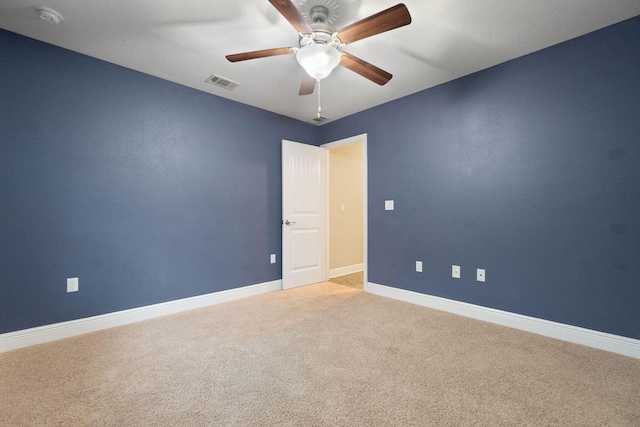 empty room featuring carpet and ceiling fan