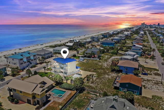 drone / aerial view with a water view and a residential view