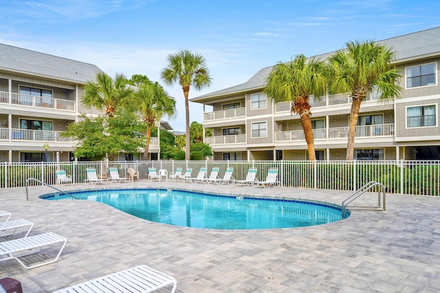 view of swimming pool with a patio area