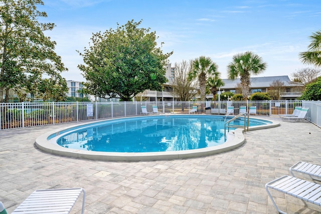 view of swimming pool with a patio area