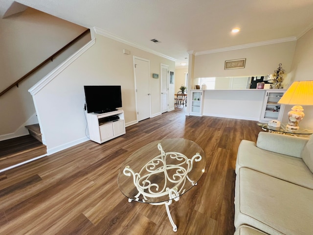 living room with crown molding and dark wood-type flooring