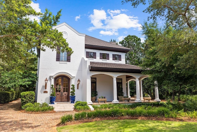 view of front of house featuring french doors and stucco siding