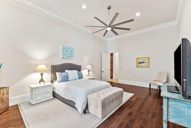 bedroom with a ceiling fan, crown molding, baseboards, and wood finished floors