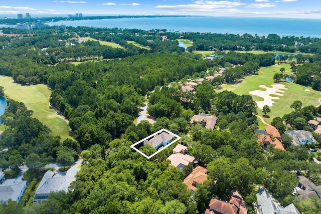 aerial view featuring golf course view and a water view