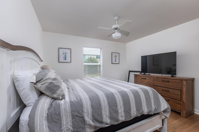 bedroom with hardwood / wood-style floors and ceiling fan