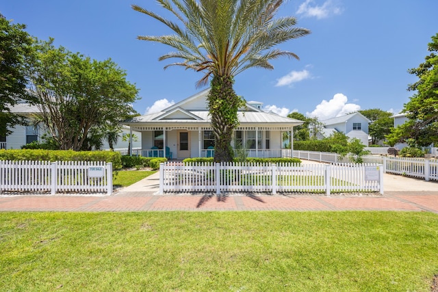 view of front of house featuring covered porch and a front yard