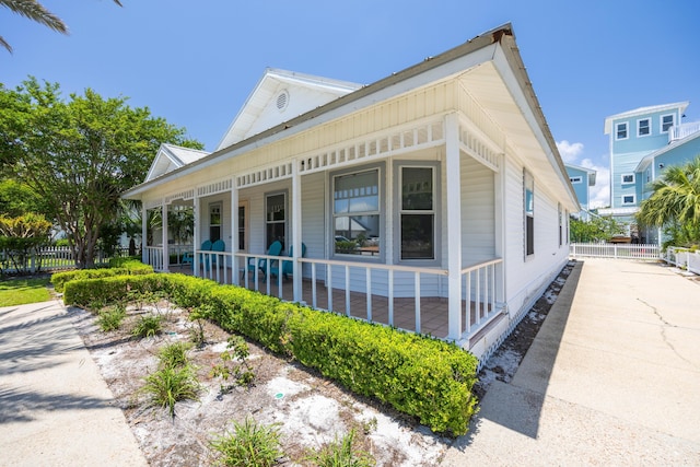 view of side of property with covered porch