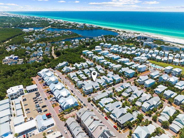 bird's eye view featuring a water view and a view of the beach