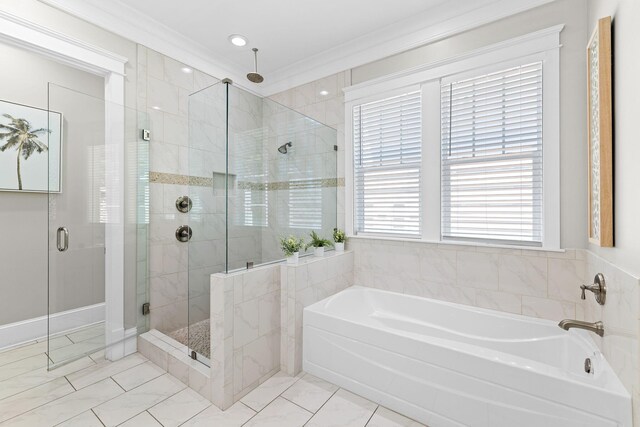 bathroom featuring crown molding and separate shower and tub