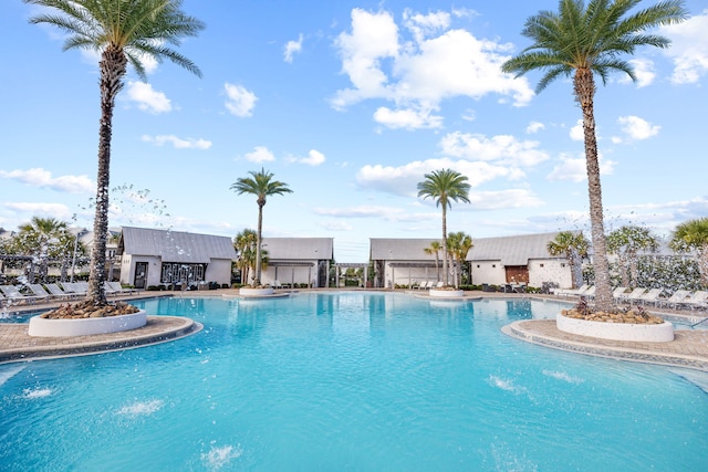 view of pool with pool water feature