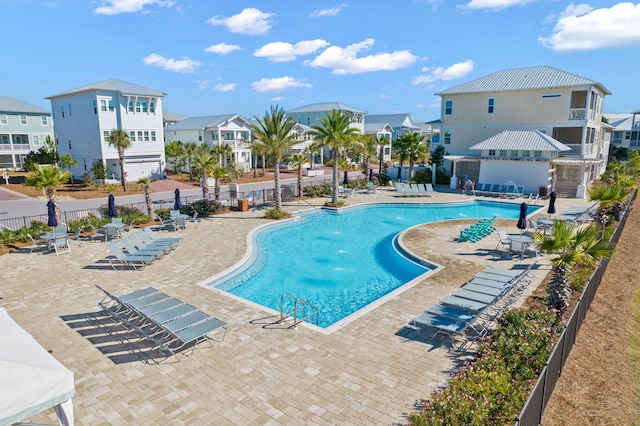 view of swimming pool featuring a patio area