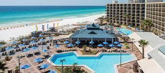 view of pool with a water view and a beach view